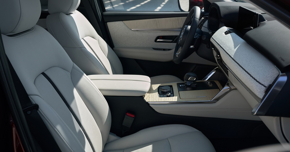 Mazda CX-90 interior with light leather seats and modern dashboard