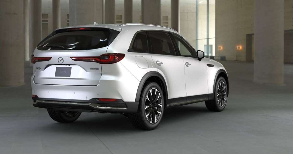 Rear three-quarter view of Mazda CX-90 SUV in white