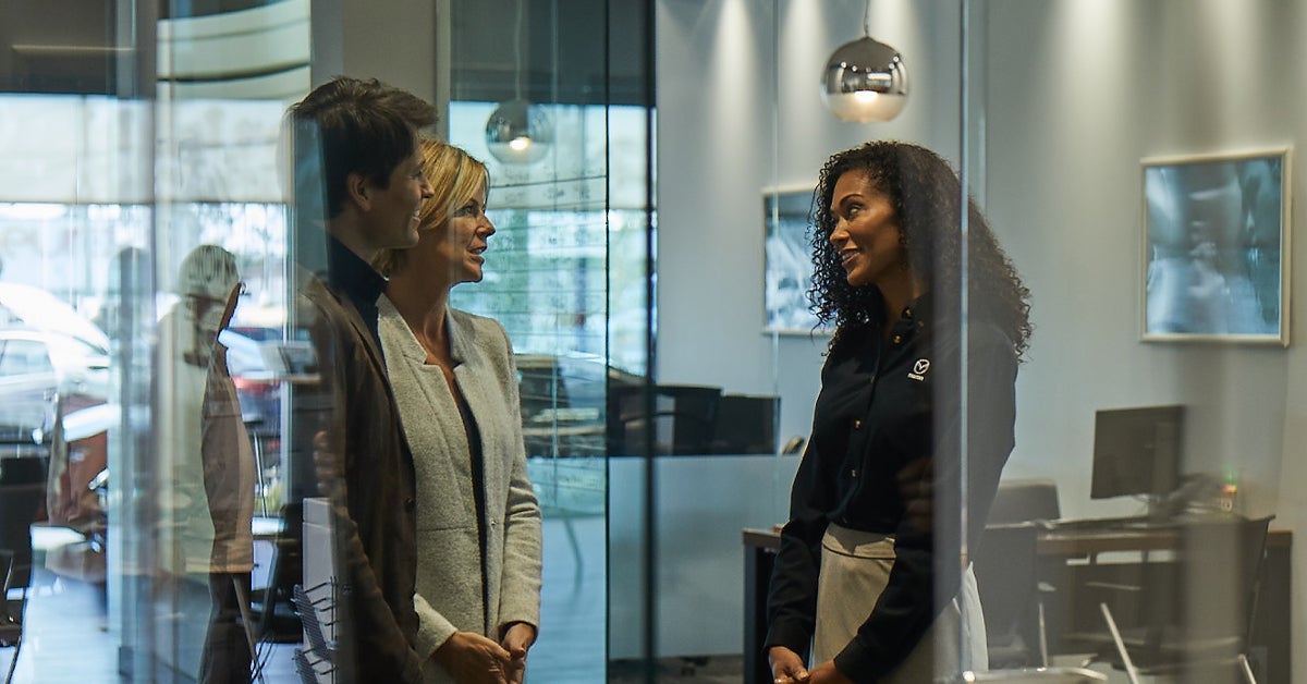 Mazda staff talking to Customers